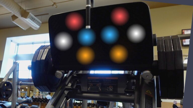 leg press machine with hotspots indicated on the platform of where to place your feet