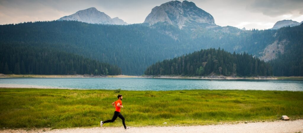 man running on nature trail